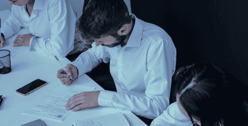 Team reviewing documents and working together in a professional office environment